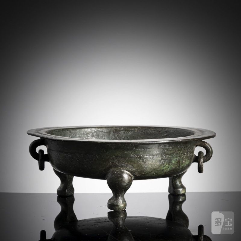 A twin-handled tripod bronze censer